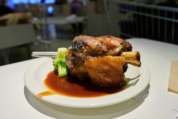 Roast pork knuckle with vegetables