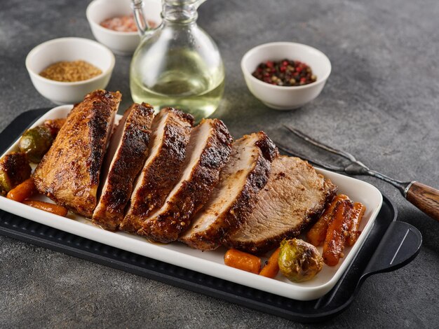 Roast pork with herbs and vegetables Grilled sliced Pork Loin