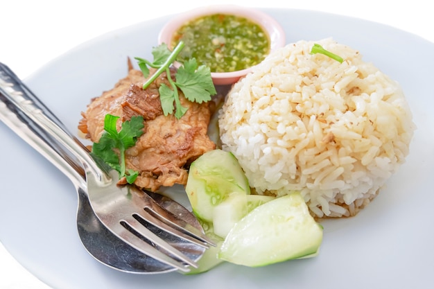 Roast pork with rice and sauce isolate on white