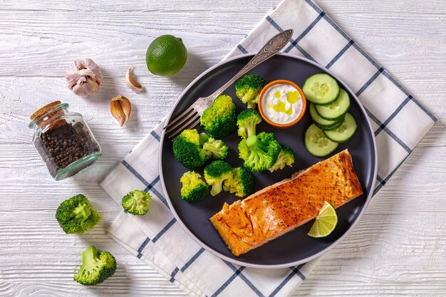 Roast salmon fillet with boiled broccoli and sauce