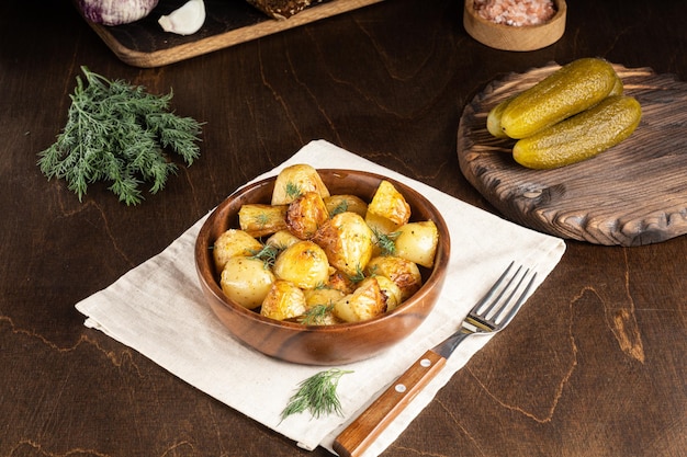 Roasted or air fryed baby potatoes with oil and dill in a bowl