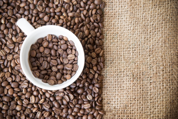 Roasted arabica coffee beans in a coffee cup