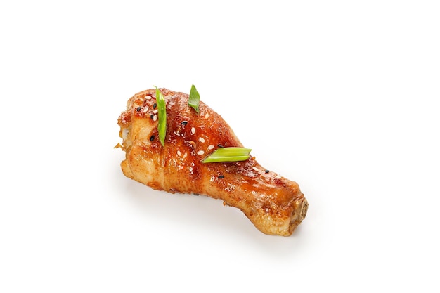 Roasted Baked chicken legs drumsticks isolated on white background with clipping path cut out