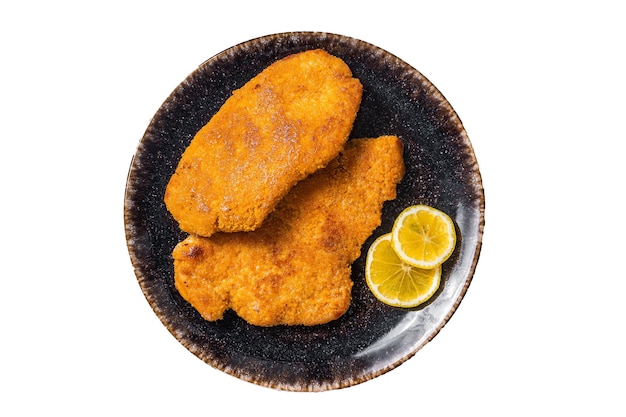 Roasted breaded german weiner schnitzel on a plate Isolated on white background