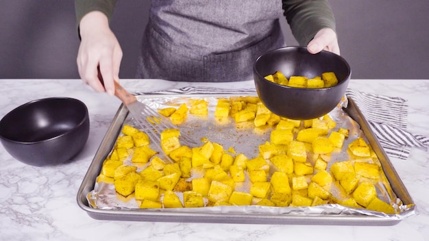 Roasted butternut squash on a baking sheet.