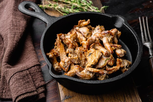 Roasted Chanterelles Ragout set, on old dark  wooden table background