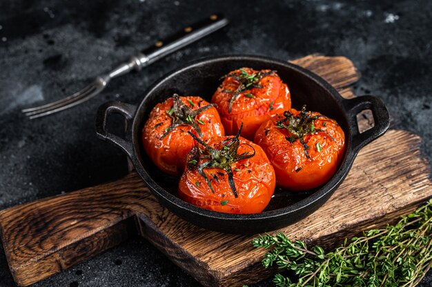 Roasted cherry tomatoes with thyme in a pan