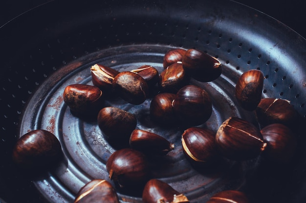 Roasted chestnuts in a pan