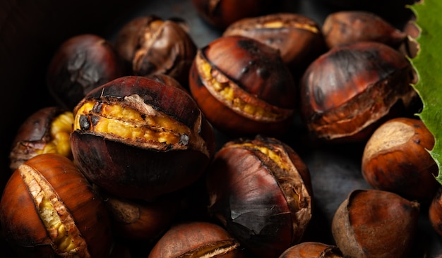 Roasted chestnuts in a pitted pan