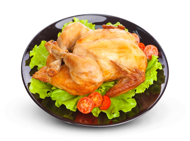 Roasted chicken on black plate