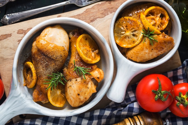Roasted chicken legs with vegetables and herbs