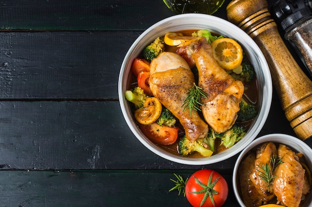 Roasted chicken legs with vegetables and herbs