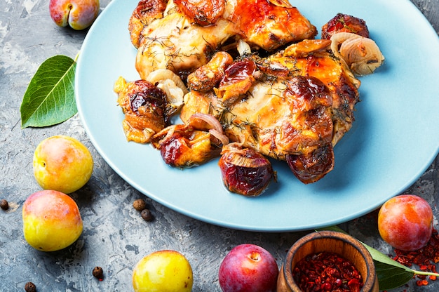 Roasted chicken stuffed with plum