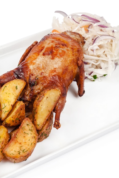Roasted chicken with potatoes and salad