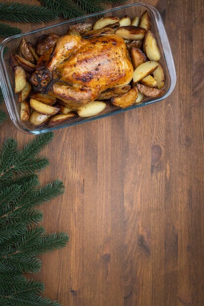 Roasted Christmas Chicken or Turkey on wooden background with copy space