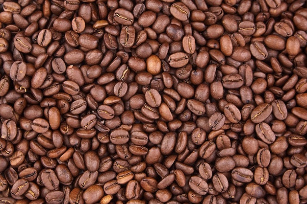 Roasted coffee beans as food background closeup