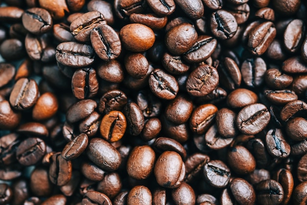 Roasted coffee beans background, close-up.