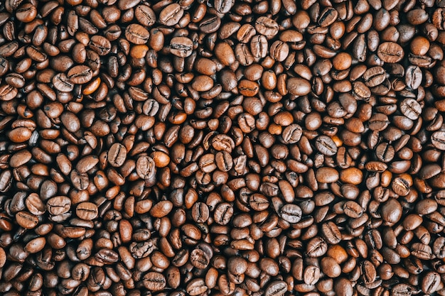 Roasted coffee beans background, top view.