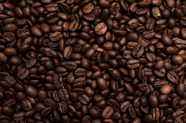 Chicchi di caffè tostati bellissimo sfondo spazio di copia vista dall'alto