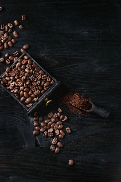 Roasted coffee beans over black