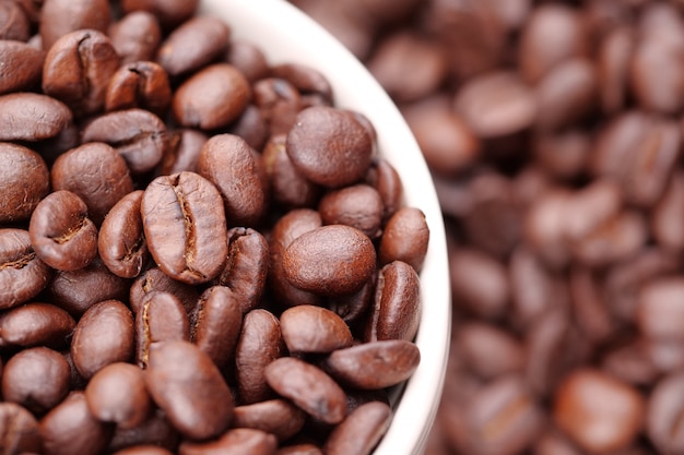 Roasted coffee beans in a coffee cup