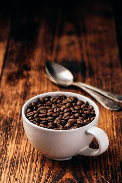 Roasted coffee beans in cup