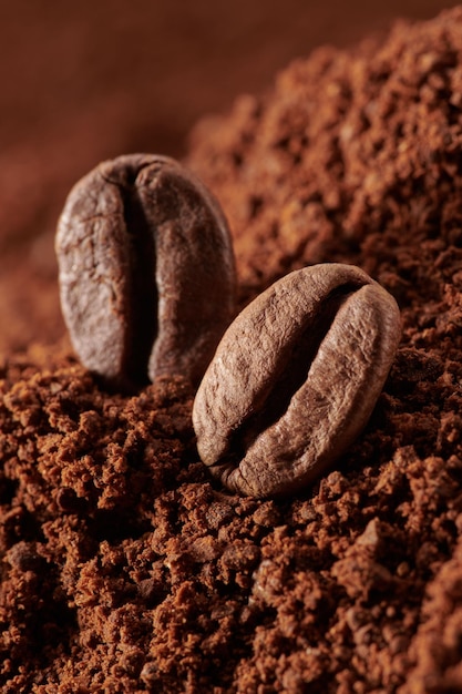 Roasted coffee beans different sort ground and whole close up background