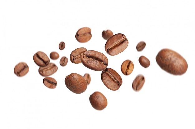 Photo roasted coffee beans fly from top to bottom with a motion effect