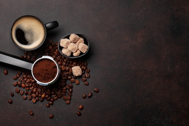 Roasted coffee beans and ground coffee in filter holder