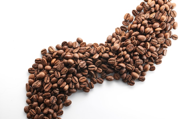 Roasted coffee beans isolated close up on white background clipping path