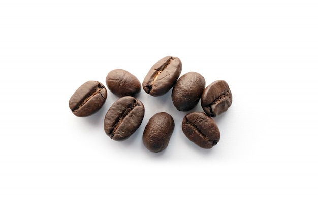 Roasted coffee beans isolated on white background.