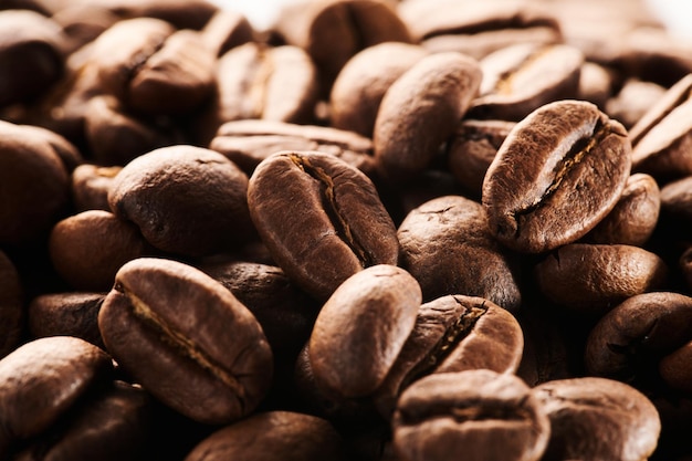 Roasted coffee beans macro close up background