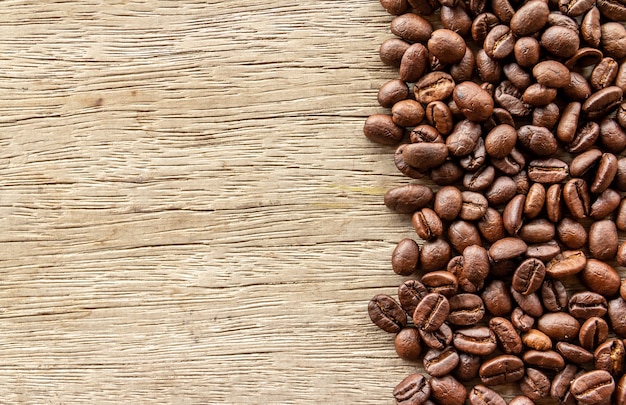 Roasted Coffee beans on old wood background