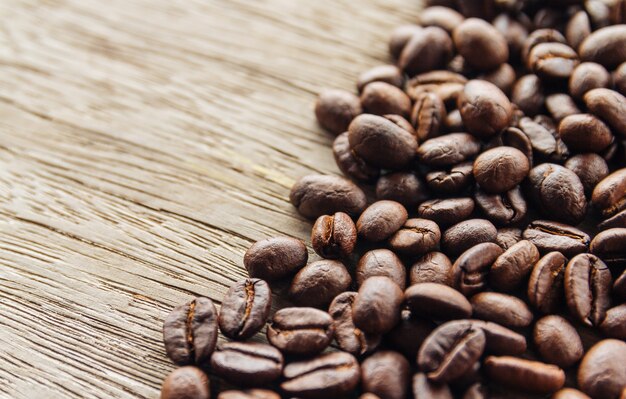 Roasted Coffee beans on old wood background