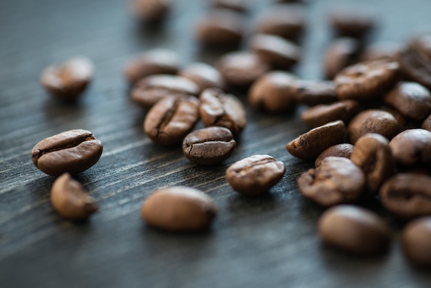 Roasted coffee beans on old wooden table