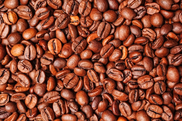 Roasted coffee beans texture background flat lay