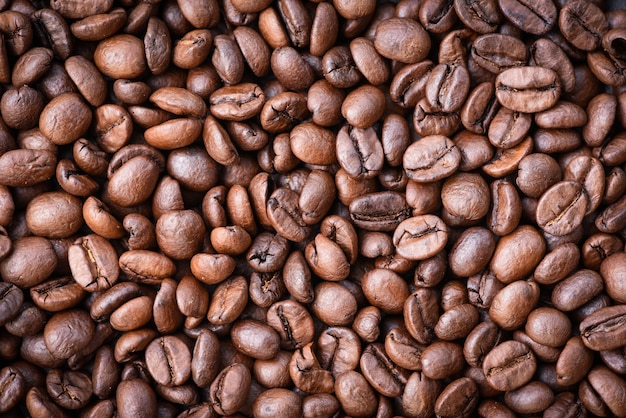 Roasted coffee beans texture / Close up coffee bean top view 