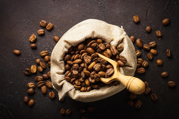 Roasted coffee beans in tha sack bag Natural coffee beans Top view with copy space