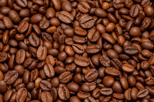 Roasted coffee beans top view Dark background