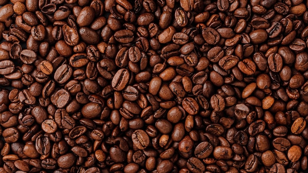 Roasted coffee beans wall texure. Overhead view