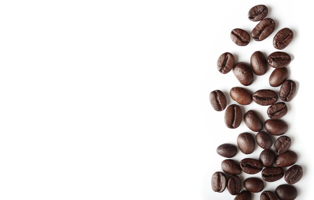 Roasted coffee beans on white background