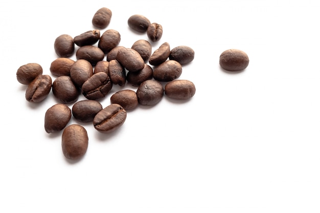 Roasted coffee beans on white background.