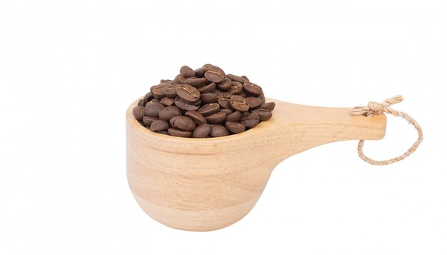 Roasted coffee beans in wood bowl isolated on white