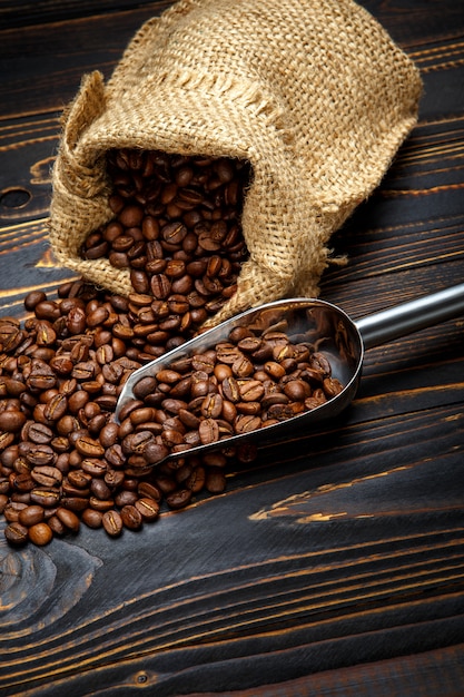 Roasted coffee beans on wooden background