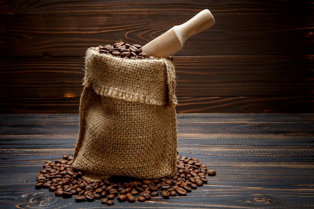 Roasted coffee beans on wooden background