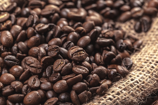 Roasted coffee beans on a wooden floor