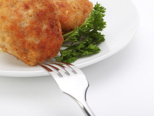 Roasted cutlets with fork