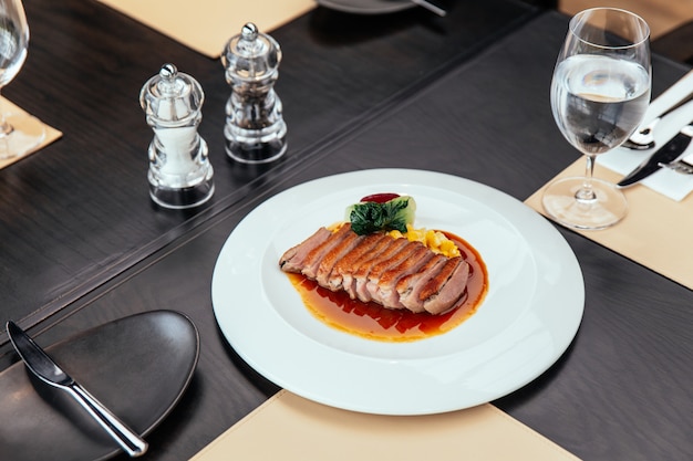 Roasted Duck Breast with cream of corn and tamarind poultry jus, Served with bread and butter.