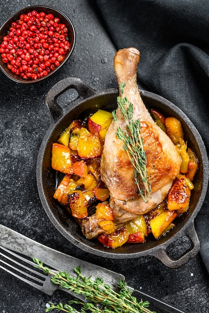 Roasted duck legs with oranges, peach and spices