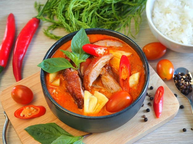 Roasted duck red curry with cherry tomato and pineapple serve with rice